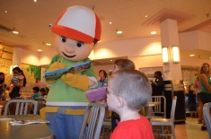 Handy Manny signing Aiden and Abby's autograph book