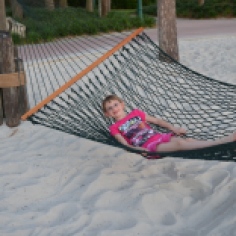 Abby swinging on a Hammock on the Beach