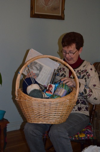 Jackie checking out her new knitting basket and supplies.