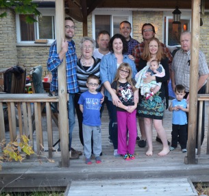 Back (L-R): Rob, Mom, Jason, Peter C, Peter A., Dad Front (L-R): Aiden, Meliss, Abby, Julie with Eva, Macklan