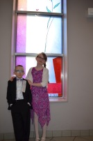 Aiden with big sister Abby after the ceremony