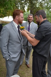 Uncle Luc putting corsage on Philip's suit.